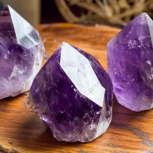 Three amethyst crystals sit atop an antique 1afb7895 6895 4c9d 95f7 f41e14dc92b7
